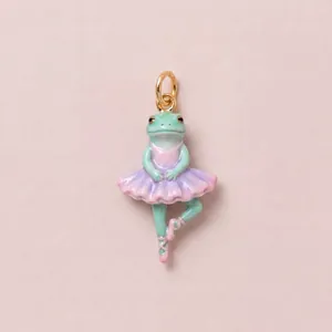 Detailed macro view of a cute enamel ballerina frog pendant with premium gold plating