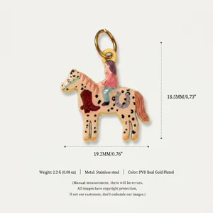 Macro detail of the 19.2mm horse and rider charm in PVD gold plated stainless steel.
