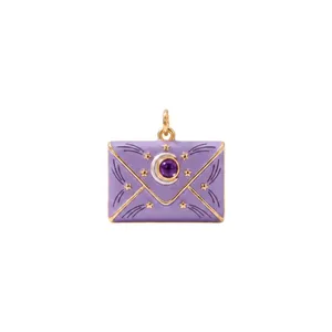 Detail view of a purple enamel envelope pendant with celestial star and moon motifs.