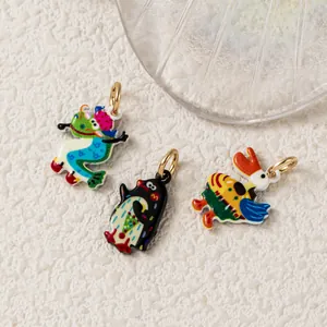 Macro detail view showing colorful enamel animal charms with 18K gold plated hanging rings