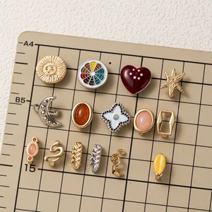 Close-up display of colorful DIY shoe charms featuring sun, moon, and heart designs