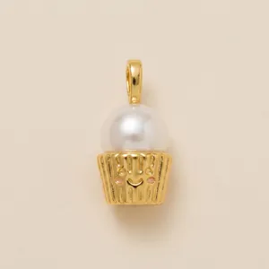Detail shot of a cute ice cream cupcake pearl pendant in gold finish