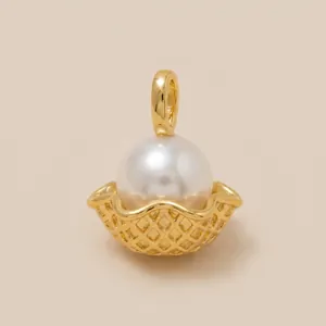 Macro view of a gold ice cream cone pearl pendant for DIY jewelry making accessories