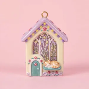 Whimsical ceramic house pendant with lavender stained glass and sleeping cat detail