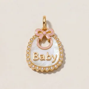 Detail view: 14K gold-plated baby bib pendant with pink enamel bow and shell inlay