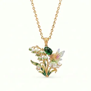 Intricate enamel pendant featuring a fairy and lily of the valley on a gold chain necklace