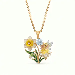 Detailed view of enamel fairy and daffodil necklace pendant with sparkling gemstone