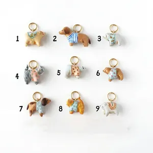 Set mit 9 süßen handbemalten Tieranhängern für DIY-Halsketten in 18K Goldoptik