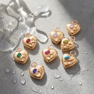 Detailed macro view of 3D relief zodiac heart pendants with colorful inlaid gemstones