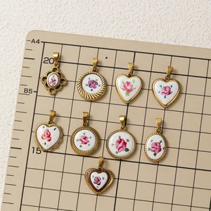 Detailed macro view of vintage 18K gold plated heart and round floral pendants for DIY jewelry