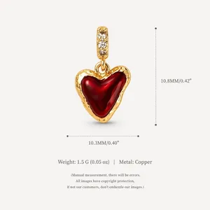 Elegant 14K gold plated copper heart pendant with red enamel inlay and zircon accents