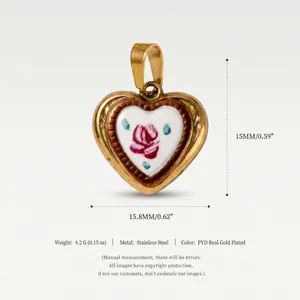 Detailed view of a gold-plated heart pendant featuring a hand-painted rose on enamel.