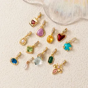 Detailed view of assorted colorful zircon birthstone pendants in 14K gold plating for DIY jewelry