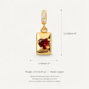Detailed size view of heart zircon pendant in 14K gold plated copper measuring 12.2x6.9mm