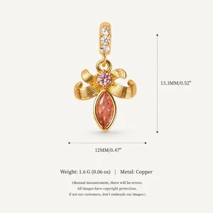Detailed view of gold plated ribbon pendant with measurements and material specs
