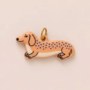 Cute dachshund dog pendant charm with blue polka dots in gold plated stainless steel metal