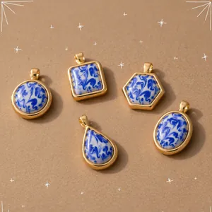 Detailed view of blue and white marble resin pendants in geometric gold frames
