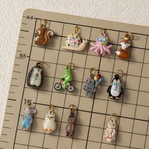 Close-up of colorful stainless steel animal charms for DIY jewelry making accessories