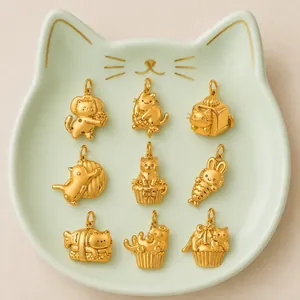 Close-up of nine cute 316L stainless steel golden cat and rabbit charm pendants.