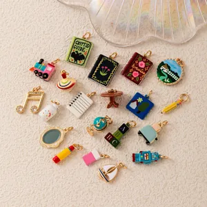 Variety of cartoon charms including book, robot, and music note designs for jewelry DIY.