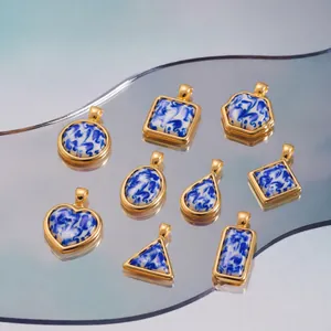 Close-up of geometric resin pendants featuring blue and white porcelain swirl patterns