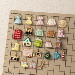 Macro view of various colorful miniature pastoral style charms on a measuring grid board