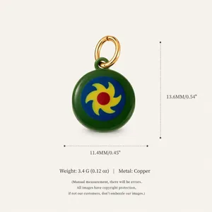 Detailed view of pastoral copper charm with colorful sun pattern including measurement details