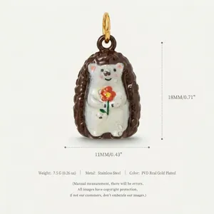 Macro detail of a cute hedgehog pendant in stainless steel with 18k gold plating info