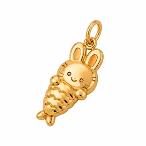 Detailed macro view of a cute 3D gold-colored rabbit carrot pendant in 316L stainless steel.