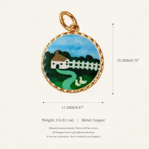 Detail showing cartoon house landscape enamel pendant with gold-toned twisted edge