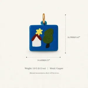 Detail view of square blue copper pendant with cartoon house and tree illustration