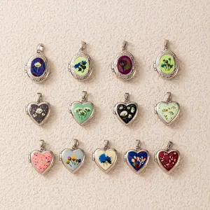 Detailed view of various colorful printed heart and oval locket pendants for DIY jewelry making
