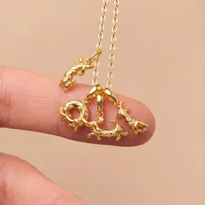 Detailed view of gold 3D Dachshund pendant with sparkling zircon on a delicate chain