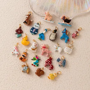 Macro view of various colorful dopamine-style animal charms with gold plated rings