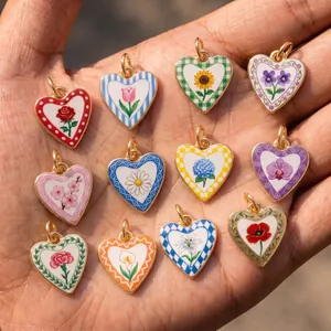 Detailed view of variety of floral heart-shaped charms for DIY jewelry making