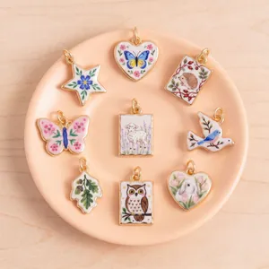 Set of vintage hand-painted animal pendants including rabbit, owl and butterfly for DIY jewelry