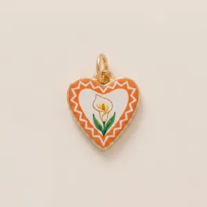 Detail shot of heart-shaped calla lily pendant with orange enamel border