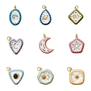 Detailed view of assorted celestial enamel charms featuring sun moon and star motifs for DIY jewelry
