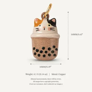 Detailed view of a cute calico cat boba tea pendant made of copper with size specs