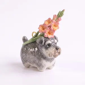 Detailed view of a ceramic Schnauzer dog charm with a pink floral crown for DIY jewelry