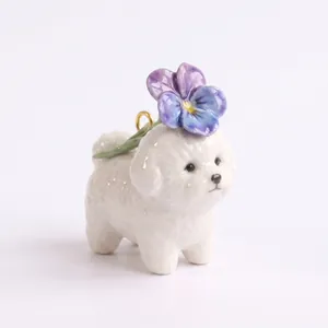 Detailed view of a ceramic Bichon dog charm with a purple flower for jewelry DIY.