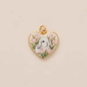 Detailed macro view of heart-shaped pendant featuring a hand-painted lop-eared rabbit