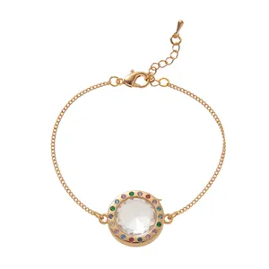 Detailed view of circular gold floating locket bracelet with rainbow gems for DIY