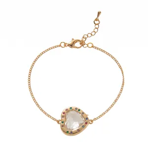Detailed view of gold-tone heart-shaped photo frame bracelet with colorful stones