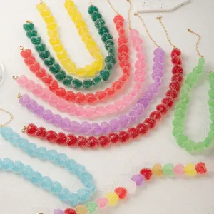 Close-up detail of colorful candy-like heart resin necklaces with sugar-frosted texture