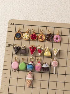 Detailed macro view of assorted cute dessert charms including cakes and donuts