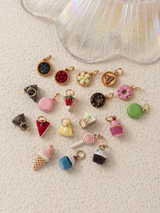 Assorted cute miniature dessert charms including cakes, donuts, and cupcakes for DIY jewelry