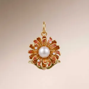 Detailed view of an elegant gold-plated enamel flower pendant with white pearls.