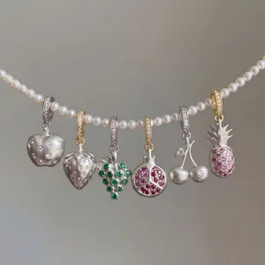 Exquisite colorful fruit charm series with sparkling zircons on a pearl necklace.