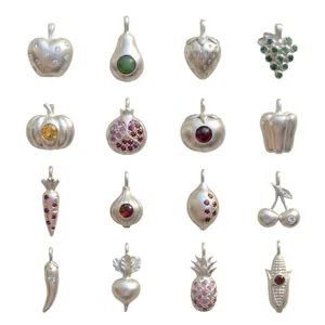 Collection of 16 silver-toned fruit and vegetable pendants with colorful zircons